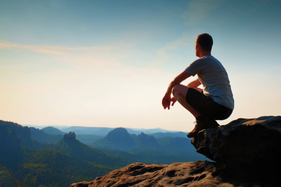 Young,Hiker,In,Black,Pants,And,Shirt,Is,Sitting,On